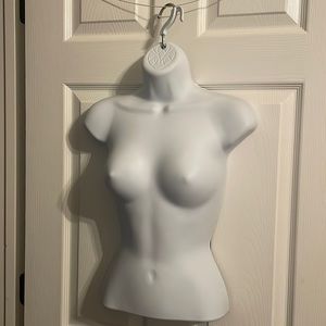 Body form to display clothing.  Female.  White plastic.